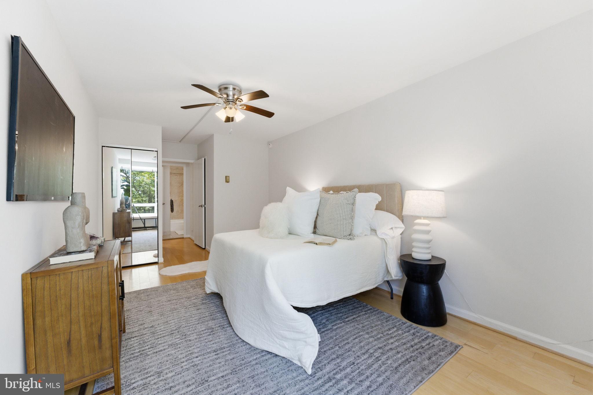 1435 4th Street Southwest, Unit B609 Washington, DC 20024 - Photo 27 of 52 a bedroom with a bed and a chandelier