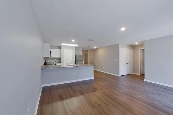 a view of kitchen with wooden floor