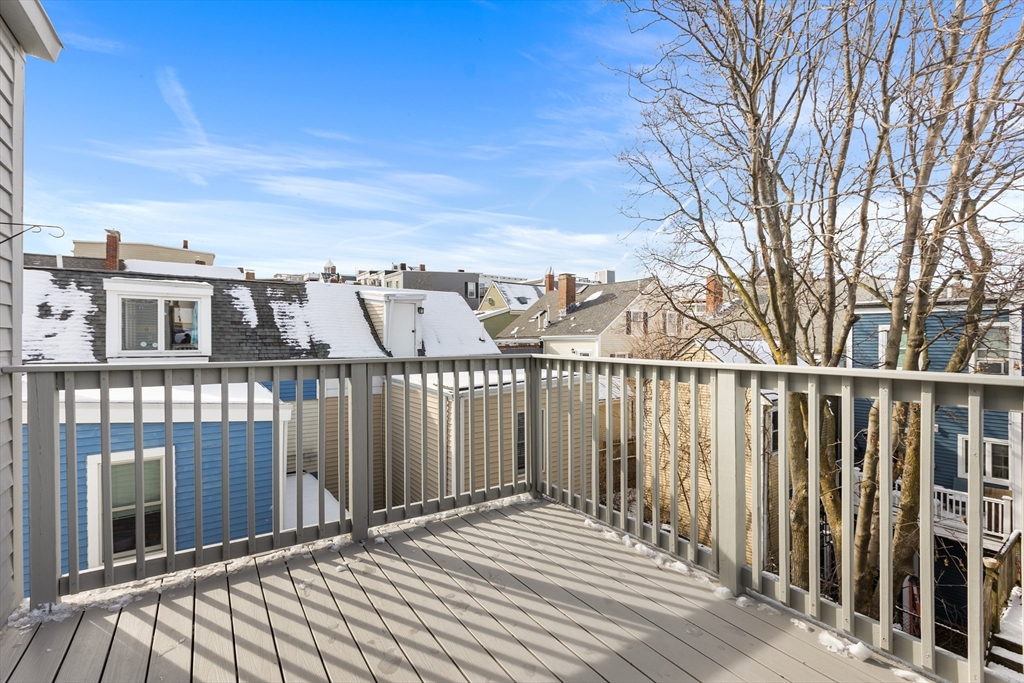 100 Pearl Street, Unit 2 Boston, MA 02129 - Photo 20 of 25 a view of a balcony with wooden fence and floor