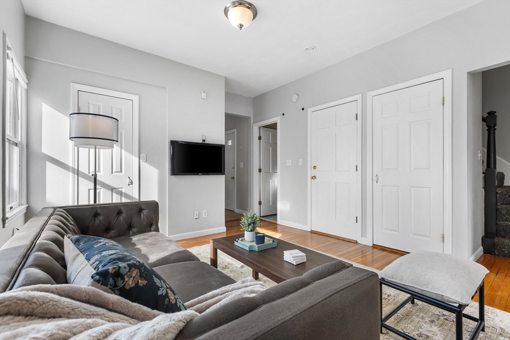 100 Pearl Street, Unit 2 Boston, MA 02129 - Photo 4 of 25 a living room with furniture and a flat screen tv