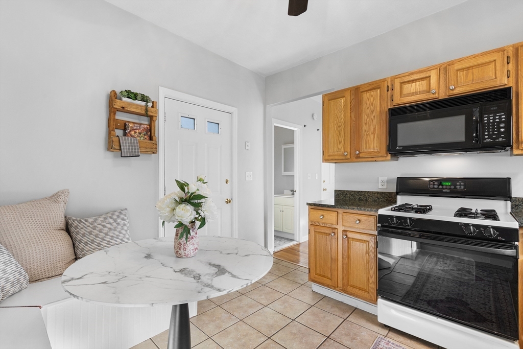 100 Pearl Street, Unit 2 Boston, MA 02129 - Photo 8 of 25 a living room with stainless steel appliances furniture a microwave oven and a sink