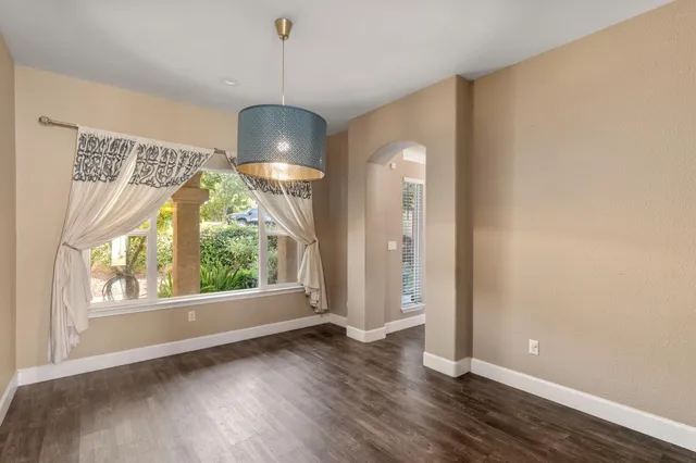 a view of a dining room with furniture and window