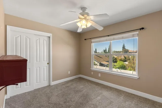 wooden floor in an empty room and a bathroom