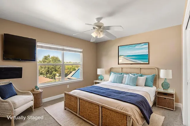 a view of an empty room with a chandelier fan
