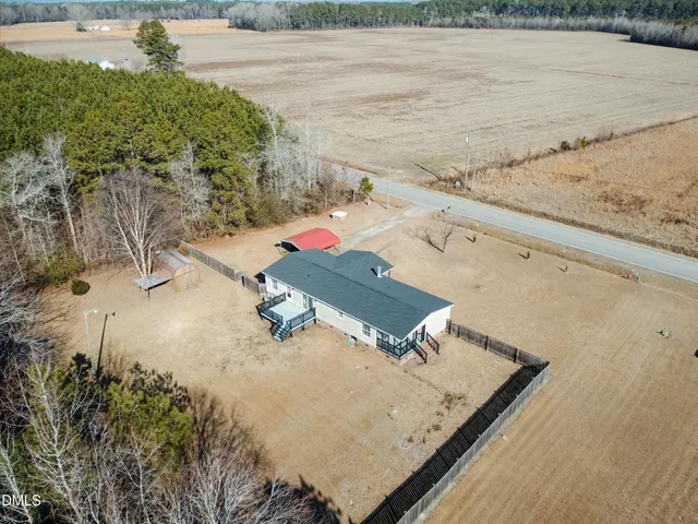 an outdoor space with furniture and water view