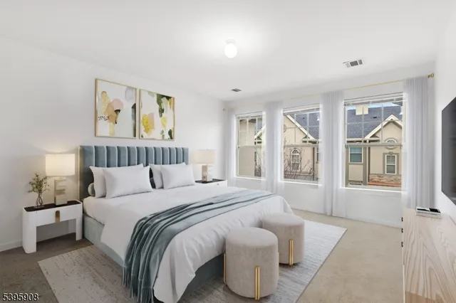 a spacious bedroom with a bed and a window