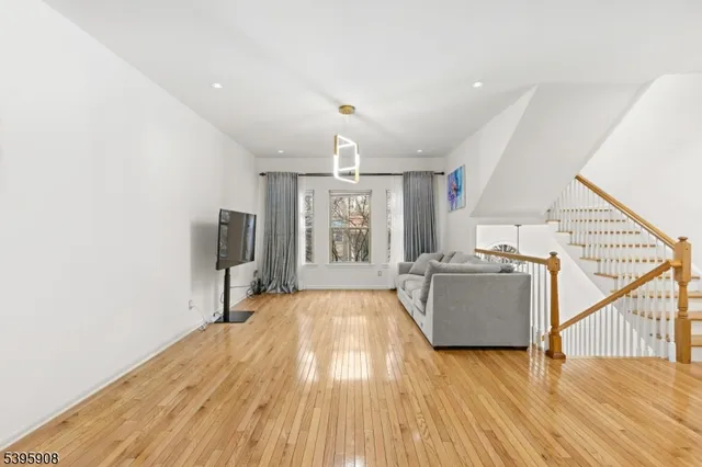 a view of a livingroom with wooden floor
