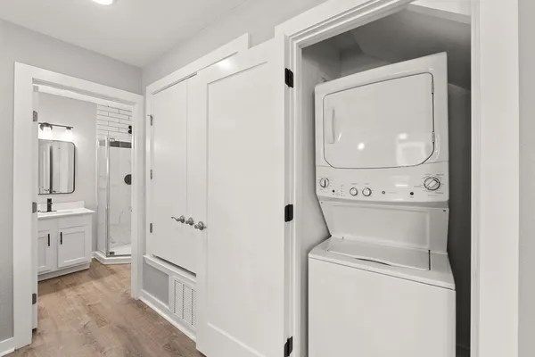 a view of bathroom with a washer and dryer