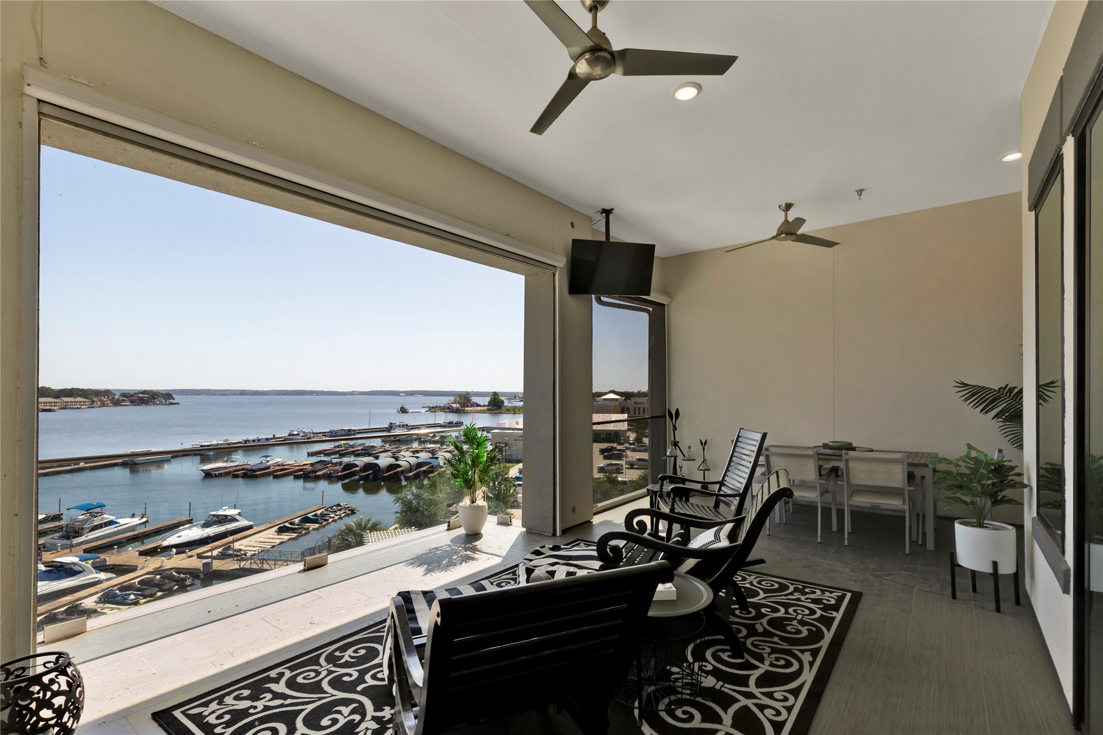 199 Waterpoint Court, Unit 412 Conroe, TX 77304 - Photo 12 of 29 a kitchen with stainless steel appliances granite countertop a stove and a view of living room