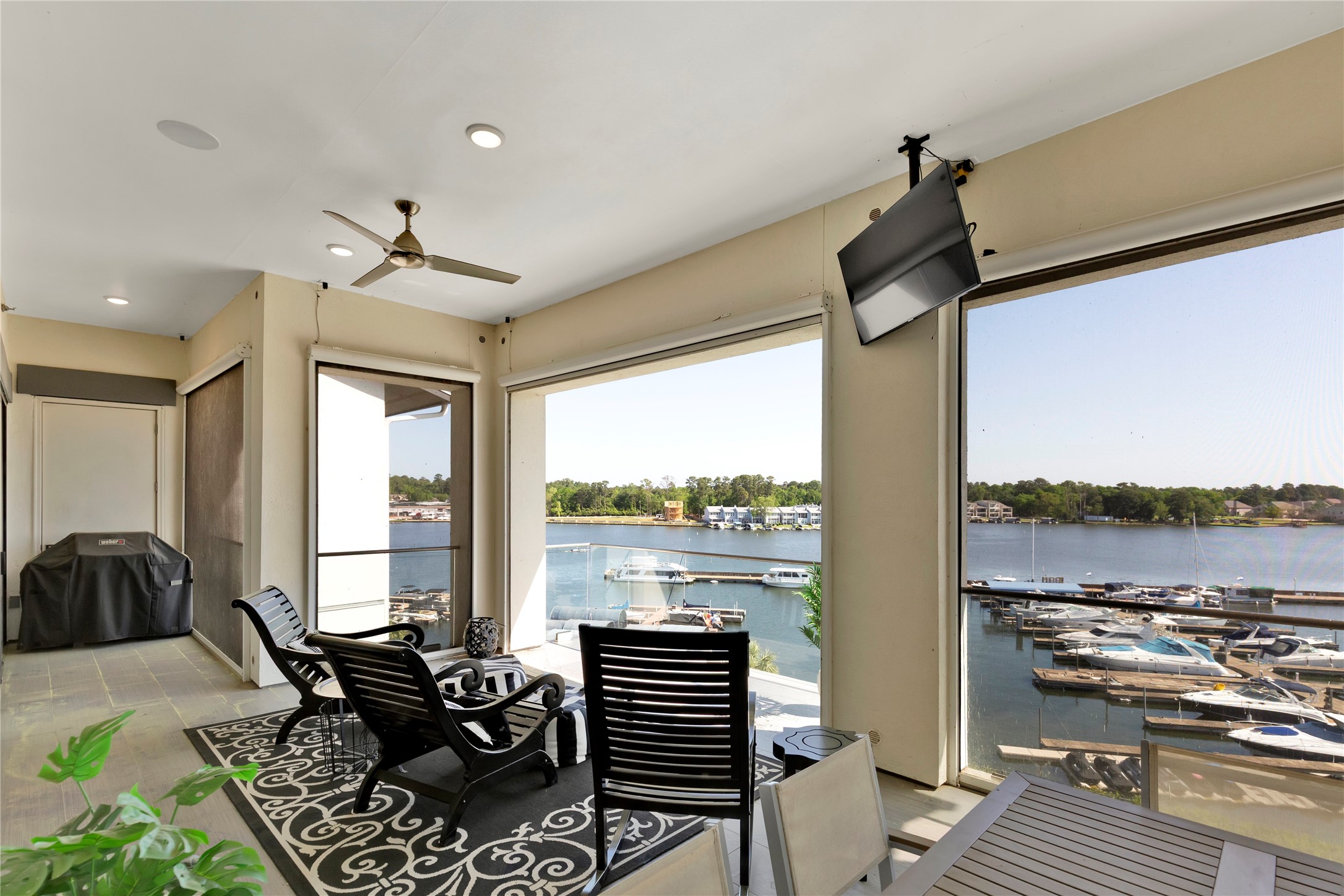 199 Waterpoint Court, Unit 412 Conroe, TX 77304 - Photo 13 of 29 a view of a living room with furniture and floor to ceiling window