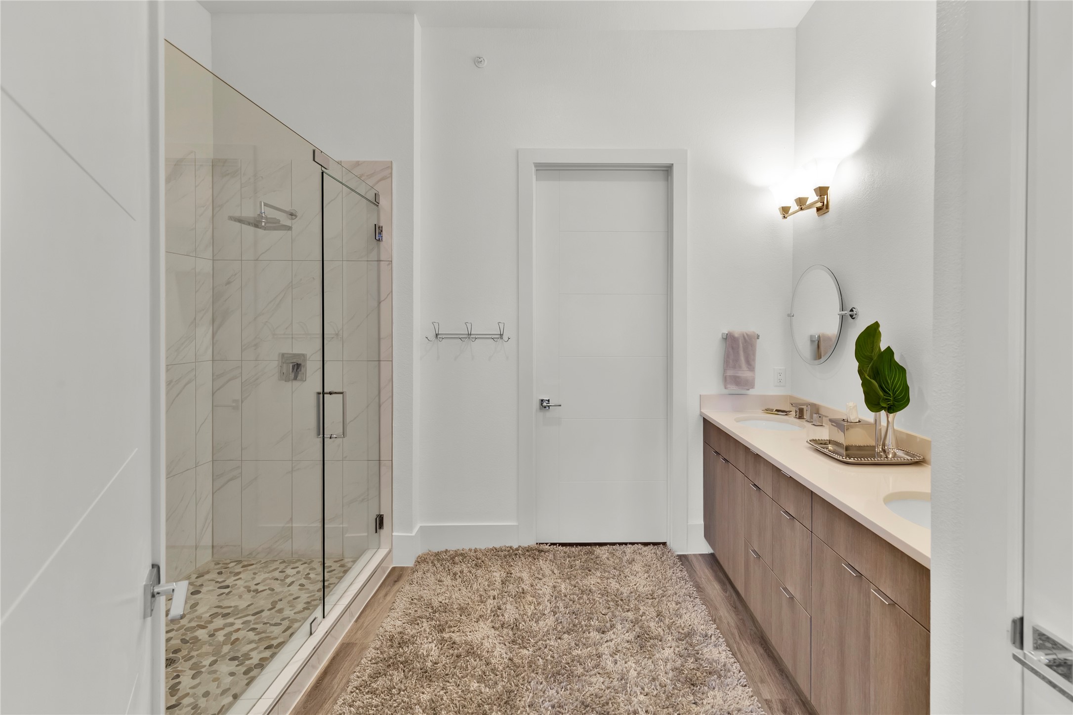 199 Waterpoint Court, Unit 412 Conroe, TX 77304 - Photo 16 of 29 a bathroom with a sink and a mirror