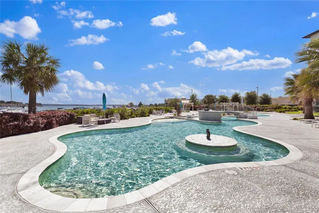 a view of a swimming pool with a yard