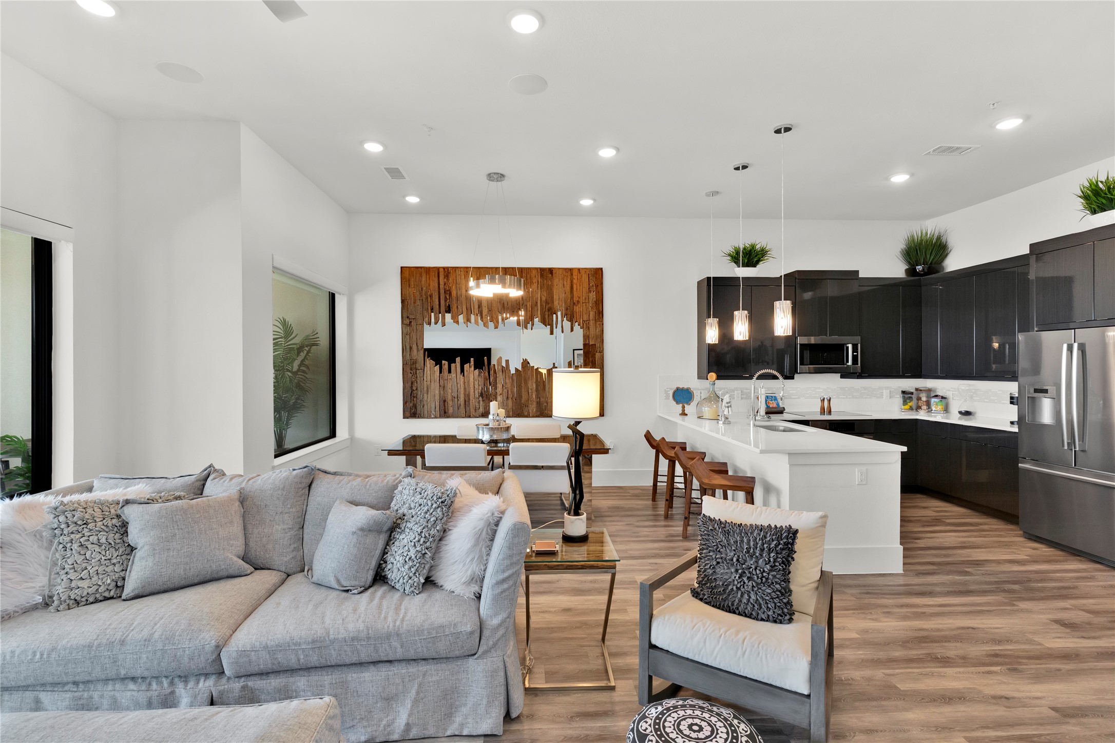 199 Waterpoint Court, Unit 412 Conroe, TX 77304 - Photo 6 of 29 a living room with furniture and view of kitchen