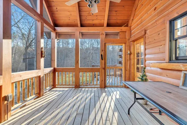 a kitchen with stainless steel appliances granite countertop a stove a sink dishwasher and a refrigerator with wooden floor