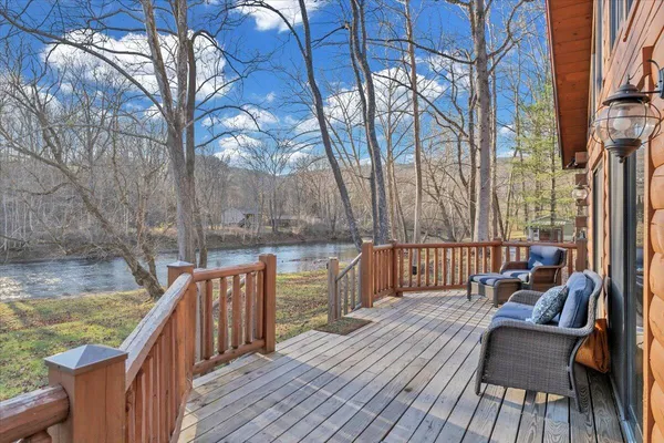 a view of deck with wooden floor and outdoor seating