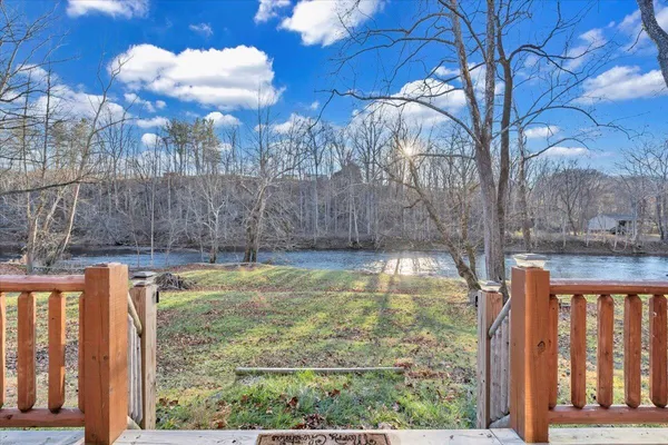 a view of a balcony with wooden floor