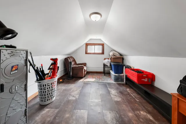 a living room with furniture and a storage