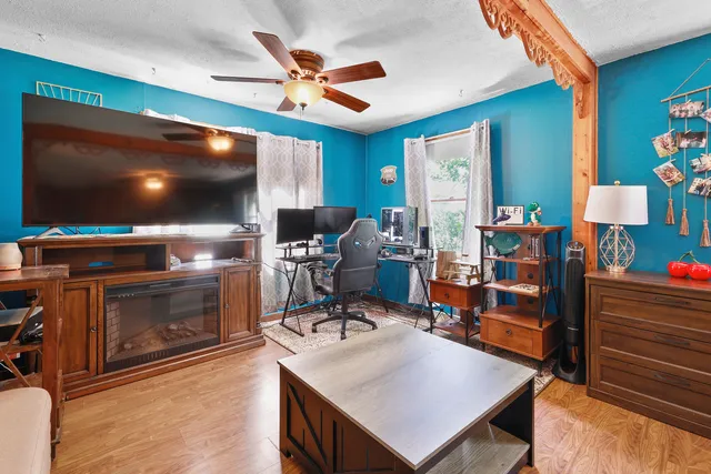 a living room with furniture and a flat screen tv