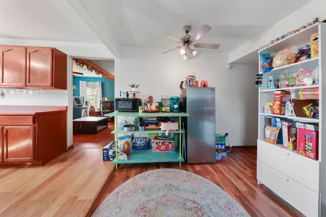 a bedroom with furniture and a book shelf