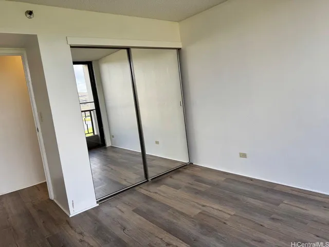 a view of an entryway with wooden floor