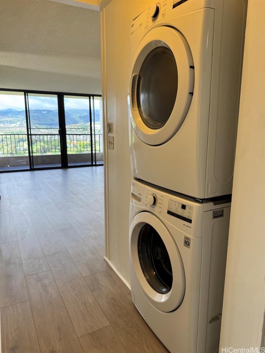 3130 Ala Ilima Street, Unit 22A Honolulu, HI 96818 - Photo 17 of 19 a view of a hallway with washer and dryer