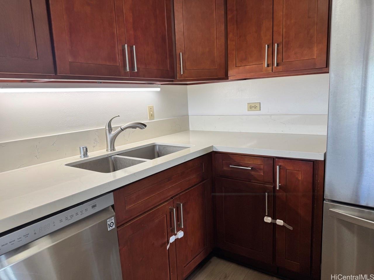 3130 Ala Ilima Street, Unit 22A Honolulu, HI 96818 - Photo 6 of 19 a kitchen with a sink and cabinets