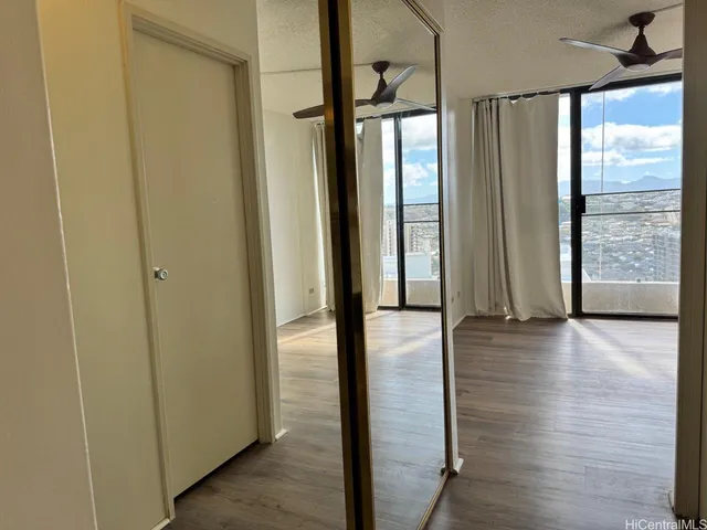 a view of gallery with wooden floor