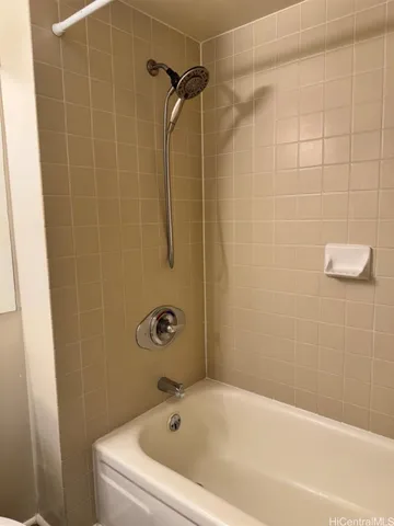 a bathroom with a bath tub