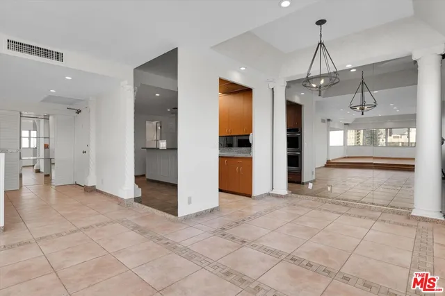 a bathroom with a shower sink and mirror