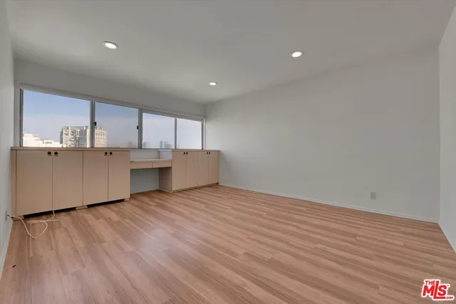 a bathroom with a sink mirror and shower
