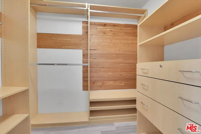 an empty room with wooden floor