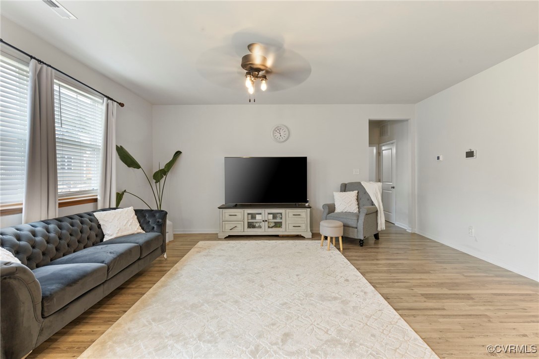 9801 Cravensford Loop Midlothian, VA 23112 - Photo 15 of 49 a living room with furniture and a flat screen tv