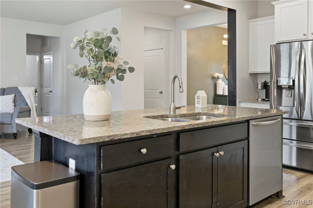 9801 Cravensford Loop Midlothian, VA 23112 - Photo 16 of 49 a bathroom with a granite countertop sink a large mirror and a shower