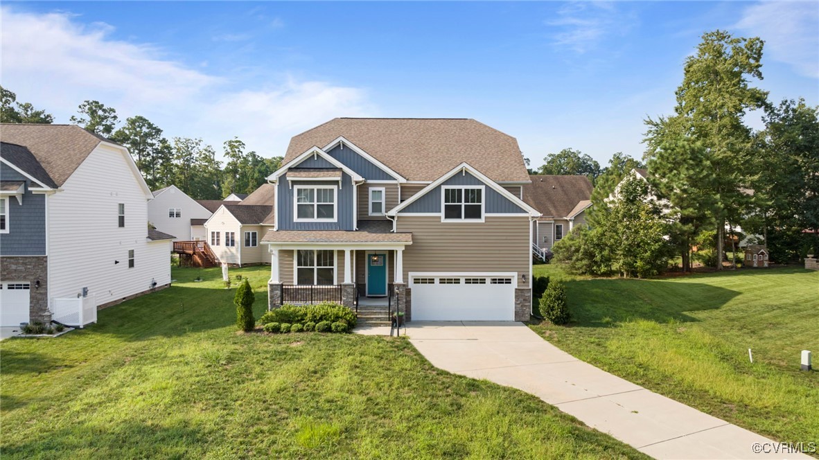 9801 Cravensford Loop Midlothian, VA 23112 - Photo 2 of 49 a front view of a house with a yard