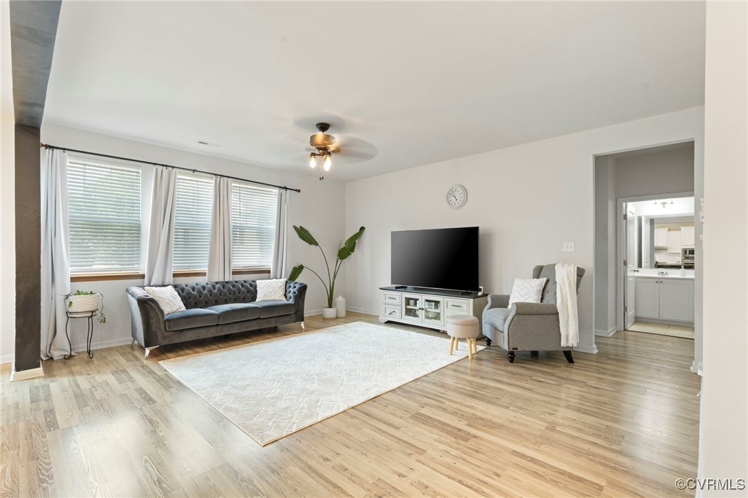 9801 Cravensford Loop Midlothian, VA 23112 - Photo 21 of 49 a living room with furniture and a flat screen tv
