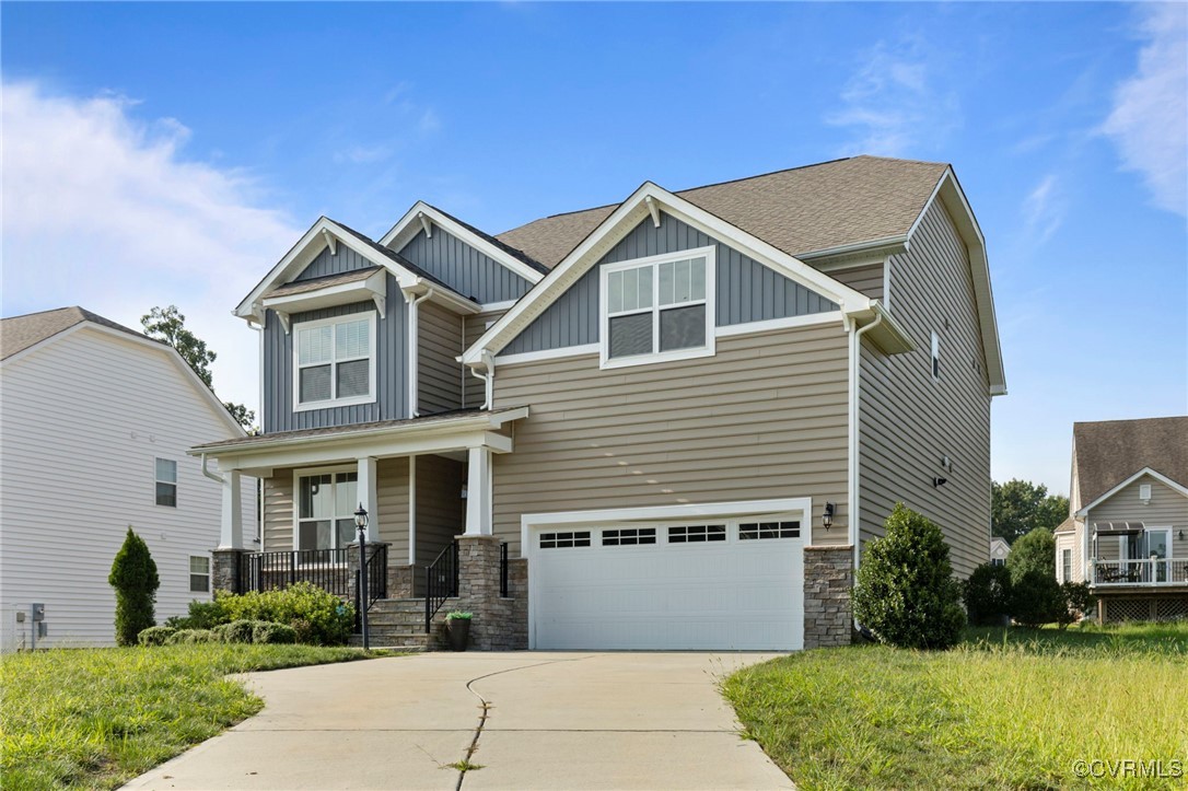 9801 Cravensford Loop Midlothian, VA 23112 - Photo 3 of 49 a front view of a house with garden