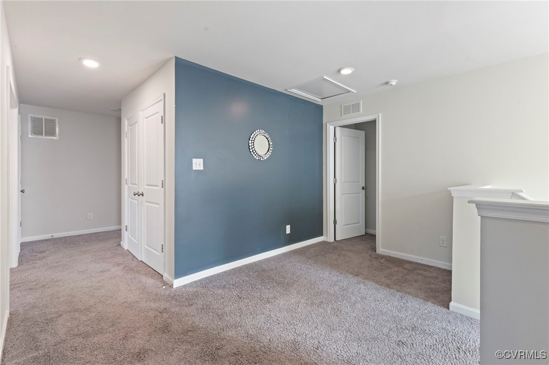 9801 Cravensford Loop Midlothian, VA 23112 - Photo 37 of 49 an empty room with closet and mirror