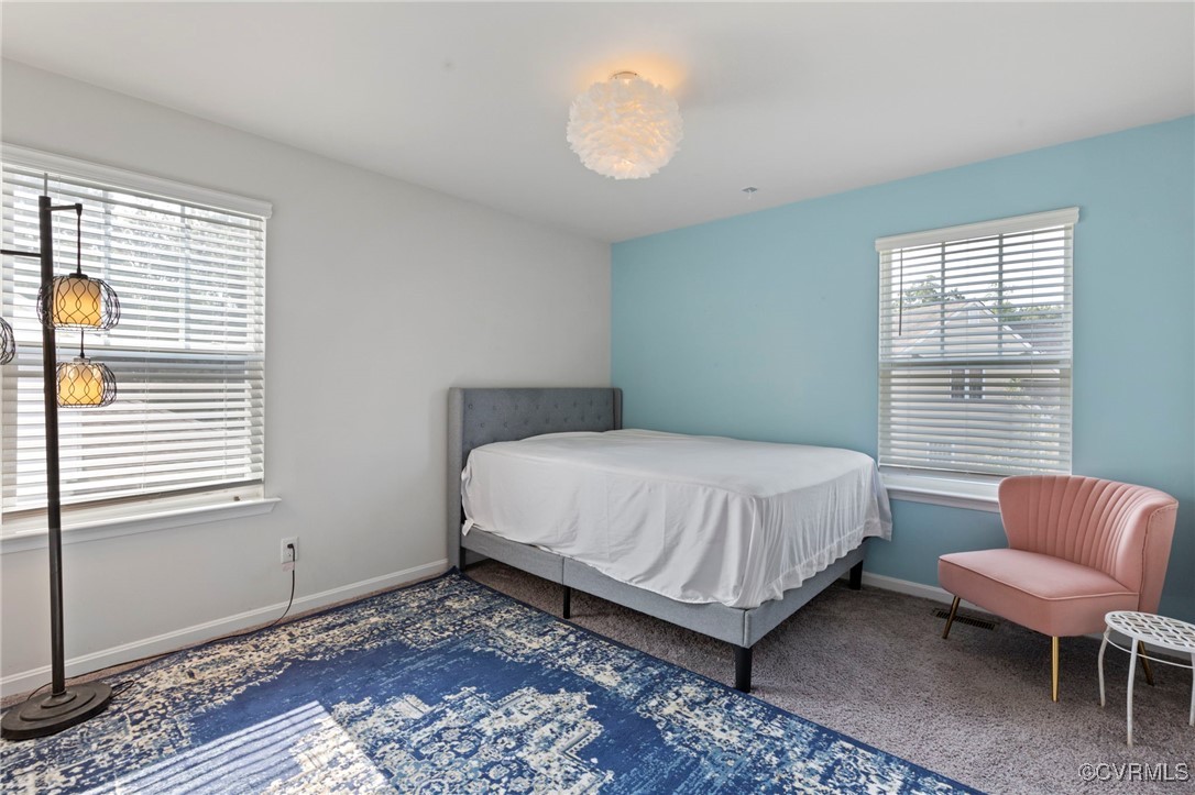 9801 Cravensford Loop Midlothian, VA 23112 - Photo 40 of 49 a bedroom with a bed and a chair