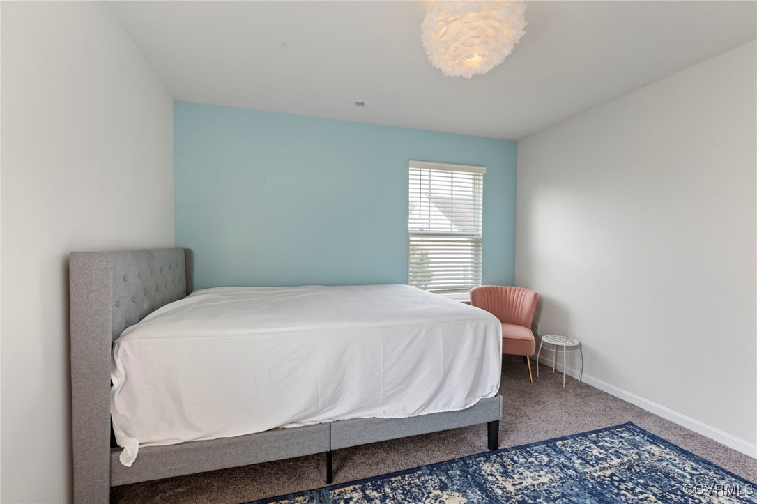 9801 Cravensford Loop Midlothian, VA 23112 - Photo 41 of 49 a bedroom with a bed and window