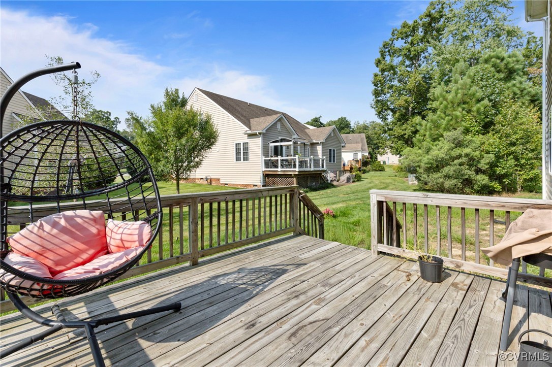 9801 Cravensford Loop Midlothian, VA 23112 - Photo 44 of 49 a view of a wooden deck with a yard