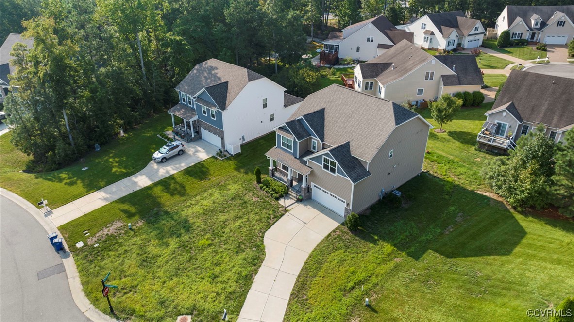 9801 Cravensford Loop Midlothian, VA 23112 - Photo 48 of 49 an aerial view of a house with a garden and swimming pool