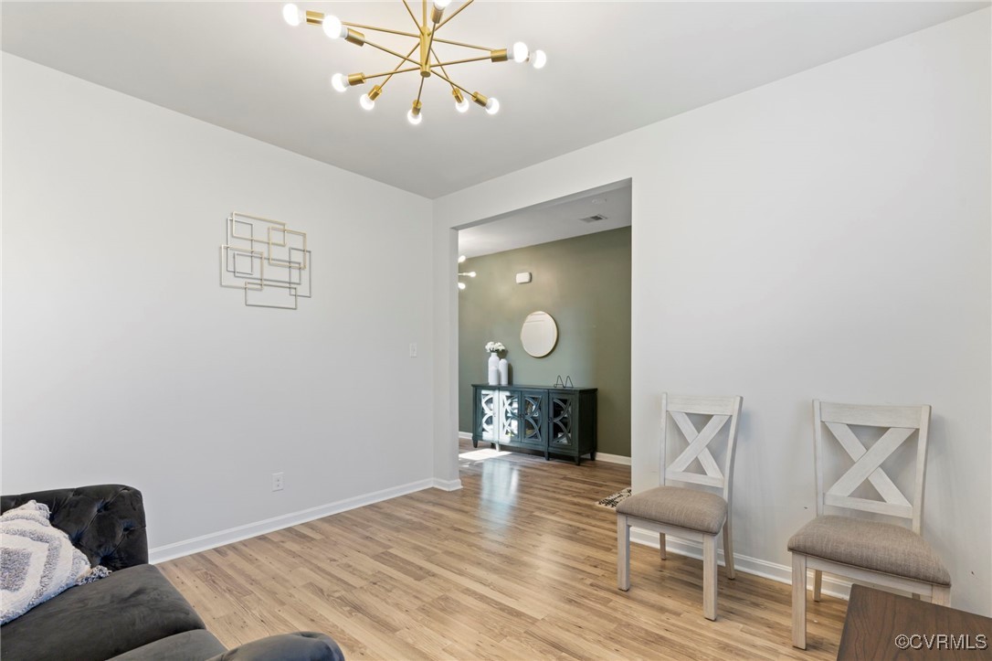 9801 Cravensford Loop Midlothian, VA 23112 - Photo 6 of 49 a view of a livingroom with furniture and wooden floor