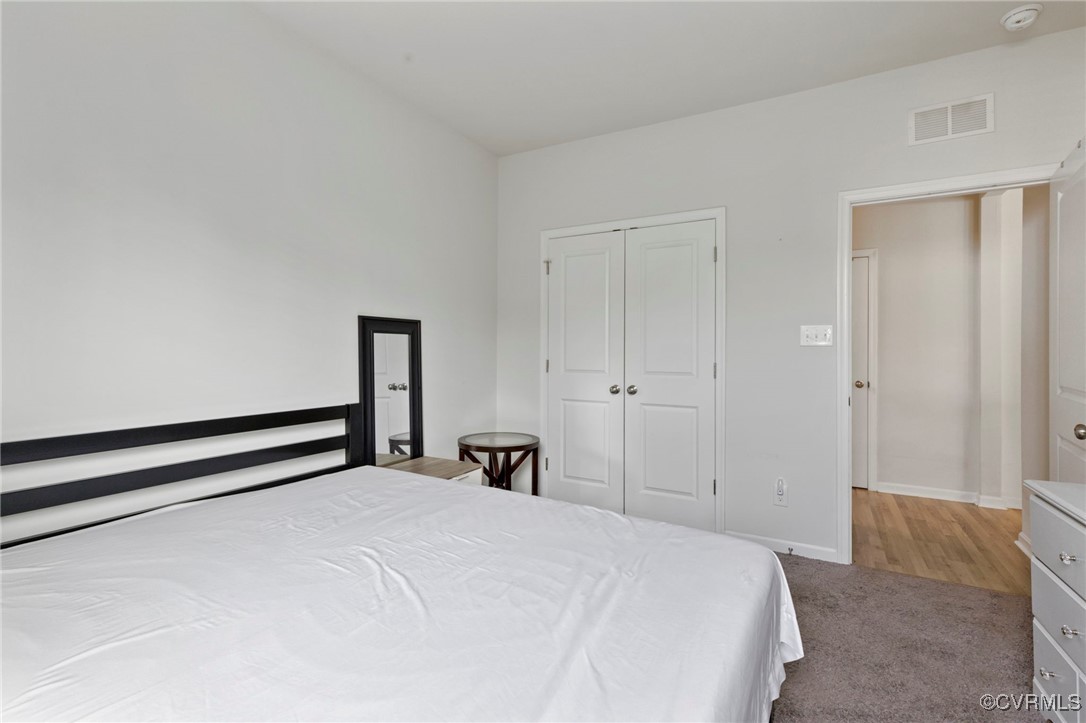 9801 Cravensford Loop Midlothian, VA 23112 - Photo 10 of 49 a bedroom with a bed and a closet