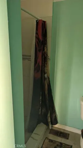 a white toilet sitting next to a small sink