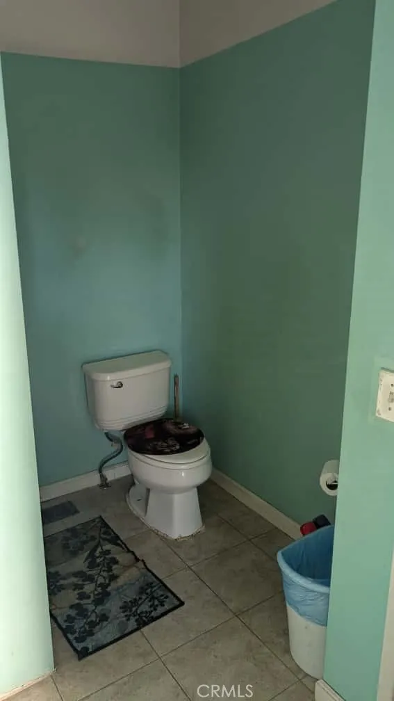 12300 West Lilac Avenue, Unit 714 Santa Ana, CA 92704 - Photo 12 of 22 a white toilet sitting next to a small sink