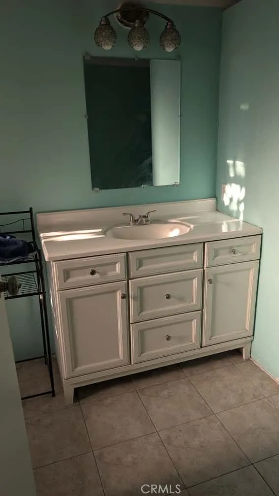 12300 West Lilac Avenue, Unit 714 Santa Ana, CA 92704 - Photo 13 of 22 a bathroom with a sink and a mirror