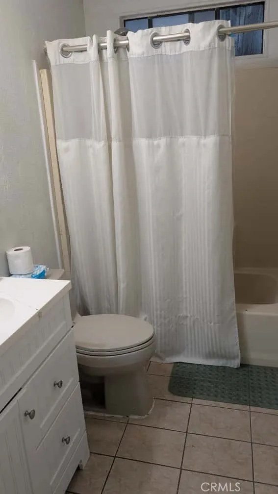 12300 West Lilac Avenue, Unit 714 Santa Ana, CA 92704 - Photo 18 of 22 a bathroom with a sink toilet and shower