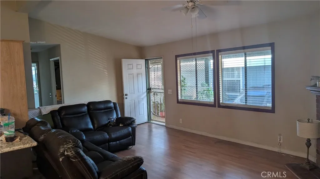 12300 West Lilac Avenue, Unit 714 Santa Ana, CA 92704 - Photo 4 of 22 a living room with furniture and a window