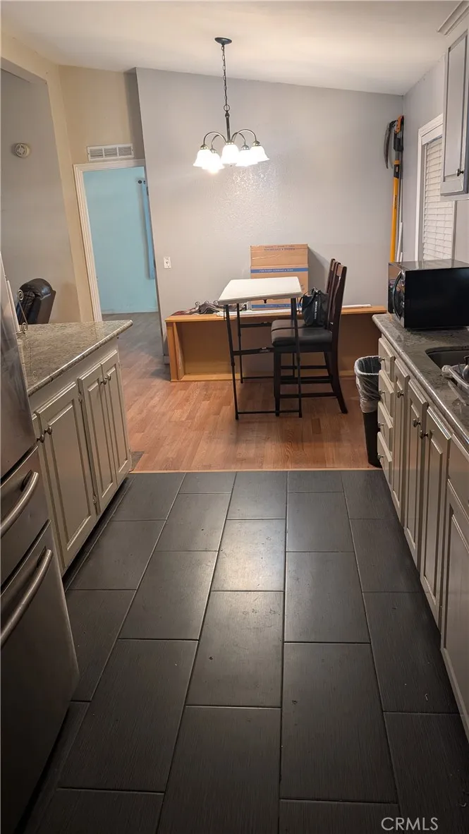 12300 West Lilac Avenue, Unit 714 Santa Ana, CA 92704 - Photo 6 of 22 a kitchen with cabinets and window