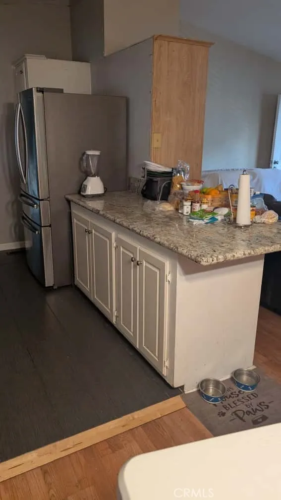 12300 West Lilac Avenue, Unit 714 Santa Ana, CA 92704 - Photo 7 of 22 a kitchen with stainless steel appliances granite countertop a sink stove and refrigerator